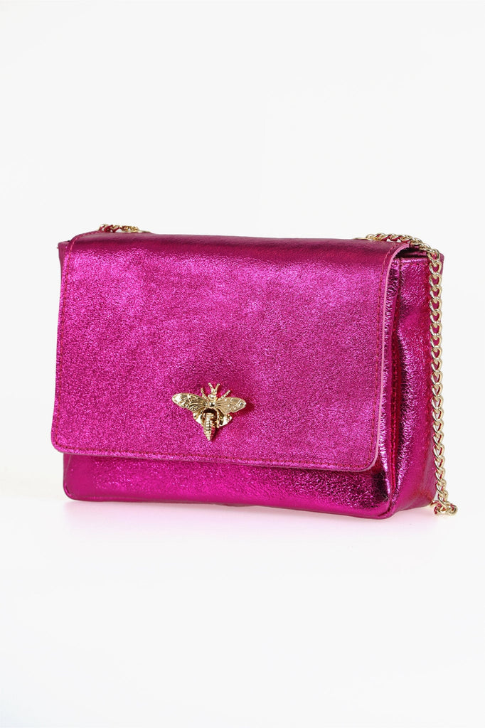 close up of the shimmery metallic pink leather bag and gold chain strap 