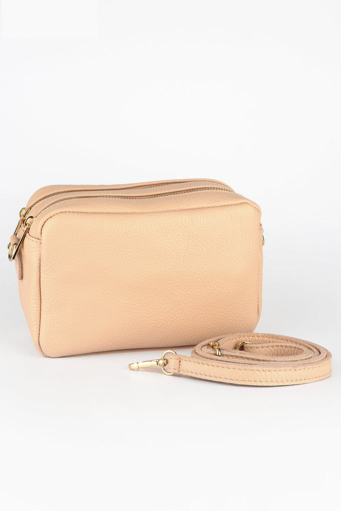 nude beige italian leather cross body camera bag with two zip closure compartments and a detachable matching bag strap