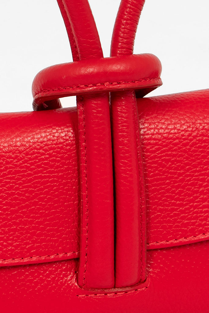 trixie-italian-leather-wristlet-clutch-bag-red-pebbled-close-up-knot-wrist-closure