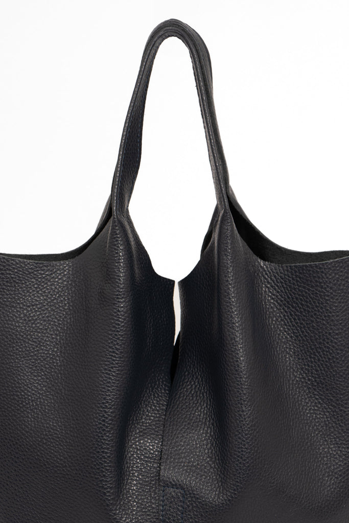 paloma-italian-leather-shoulder-bag-navy-blue-pebbled-close-up-top-handles