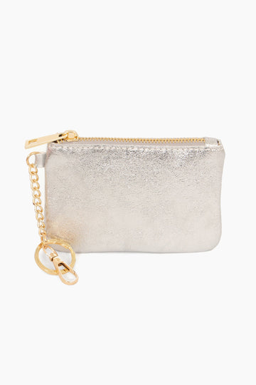 small metallic silver leather coin purse with gold hardware. the purse has a zip closure fastening on the top and two gold clip on attachments, a key ring attachment and a snap hook attachment.