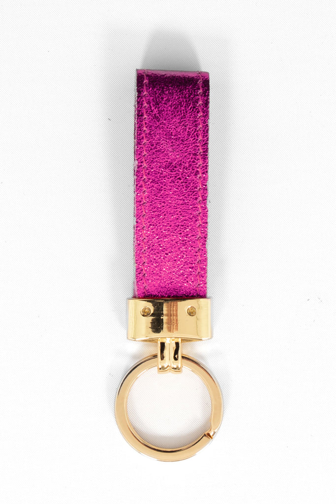 metallic raspberry pink leather loop keyring with a gold loop attachment. 