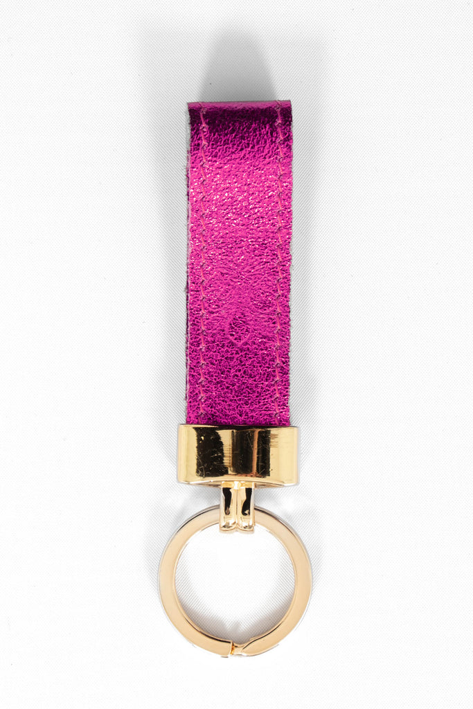 metallic raspberry pink leather loop keyring with a gold loop attachment. 