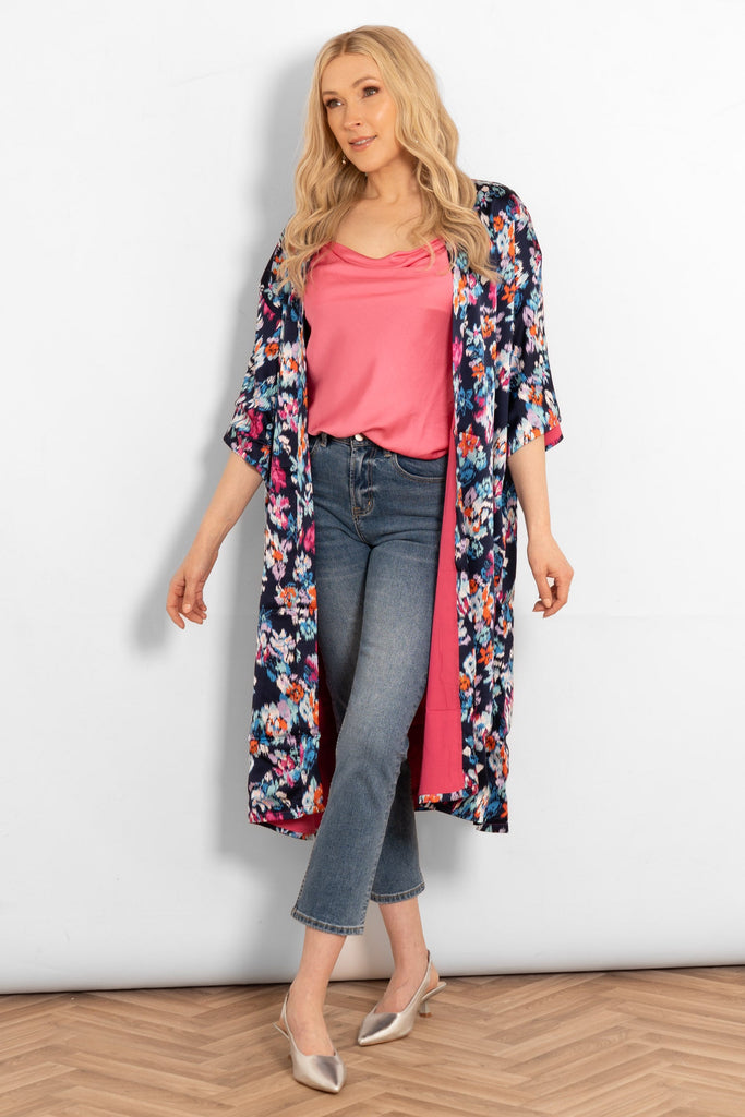lined-silky-mid-length-kimono-jacket-navy-blue-floral-on-model-styled-with heels