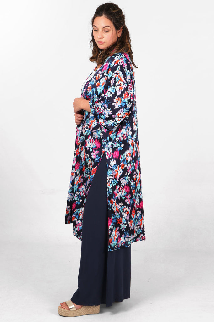 mid length lined kimono jacket in navy blue with an all over abstract floral print pattern