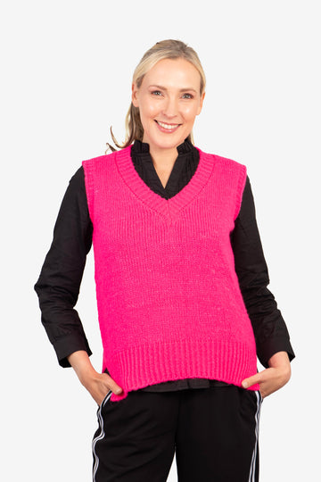 model wearing a fuchsia pink knitted tank top with a v neck 