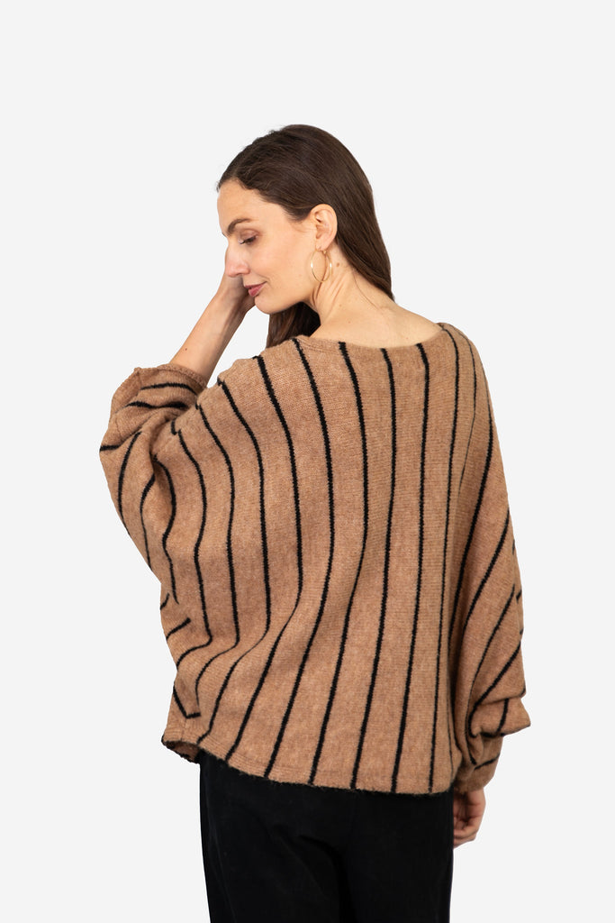 model showing the back of the jumper with an all over striped pattern