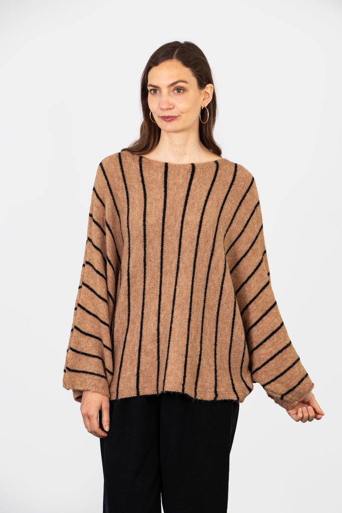 model showing the back of the jumper with an all over striped pattern