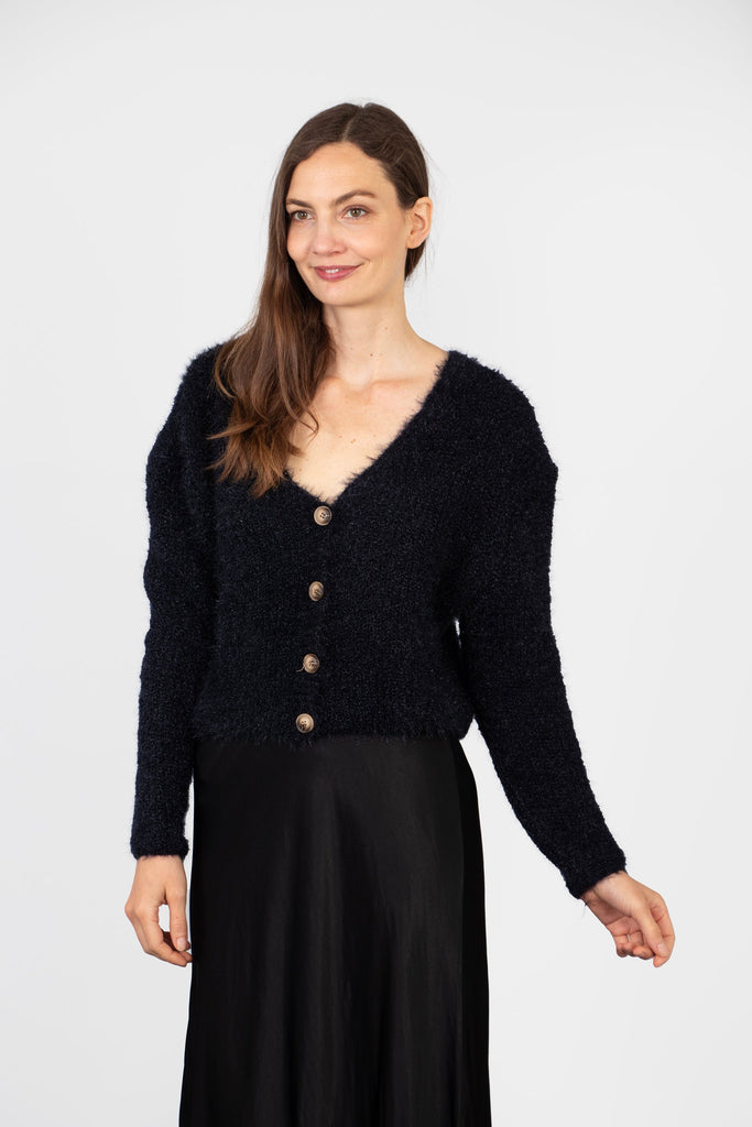 model wearing a navy blue long sleeve cardigan