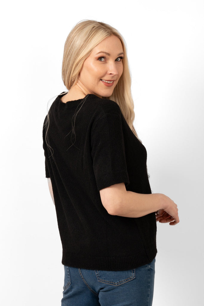 cece-wool-blend-short-sleeve-box-jumper-black-model-showing-the-rear-view-the-hemline-falls-on-the-hips