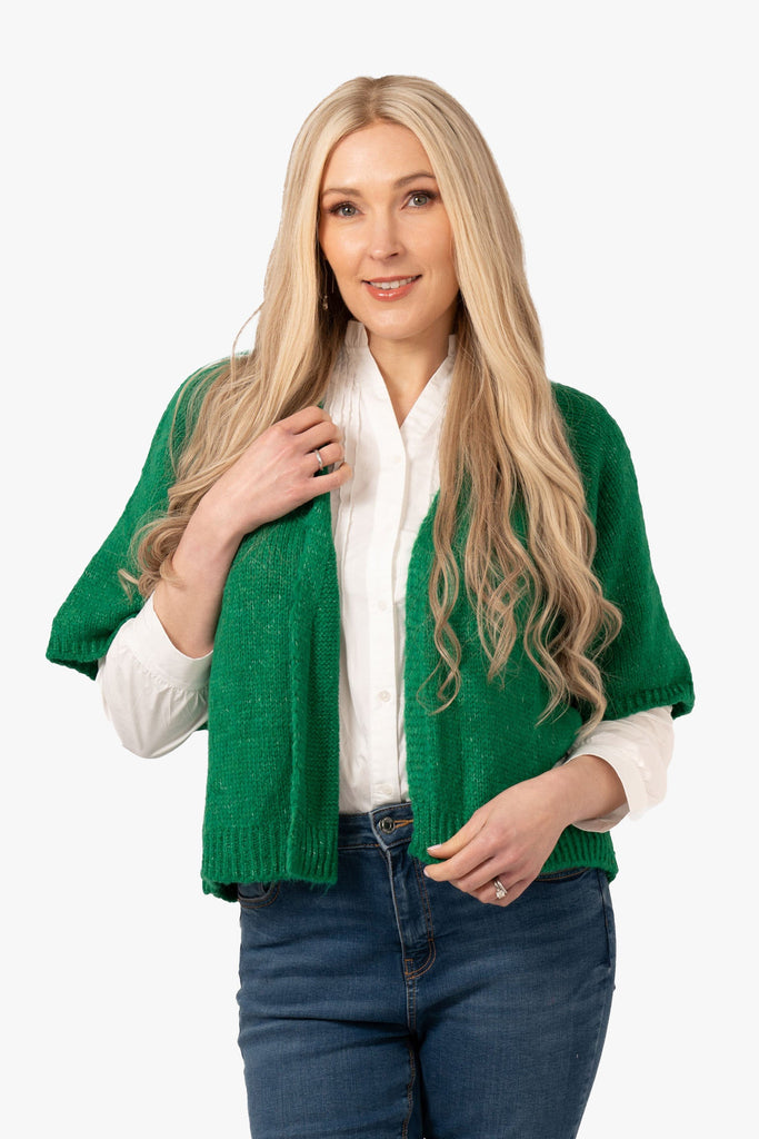 amelia-short-sleeve-wool-blend-cardigan-green-worn-by-a-model-showing-the-front-of-the-piece