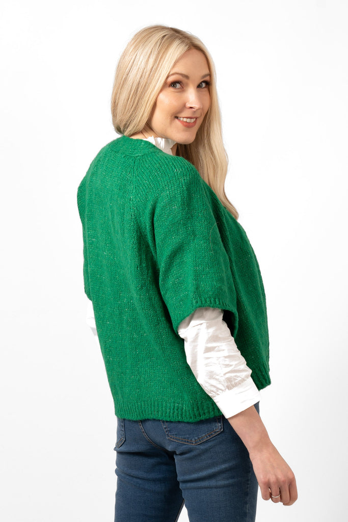 amelia-short-sleeve-wool-blend-cardigan-green-side-view-showing-the-loose-fitting-elbow-length-sleeves