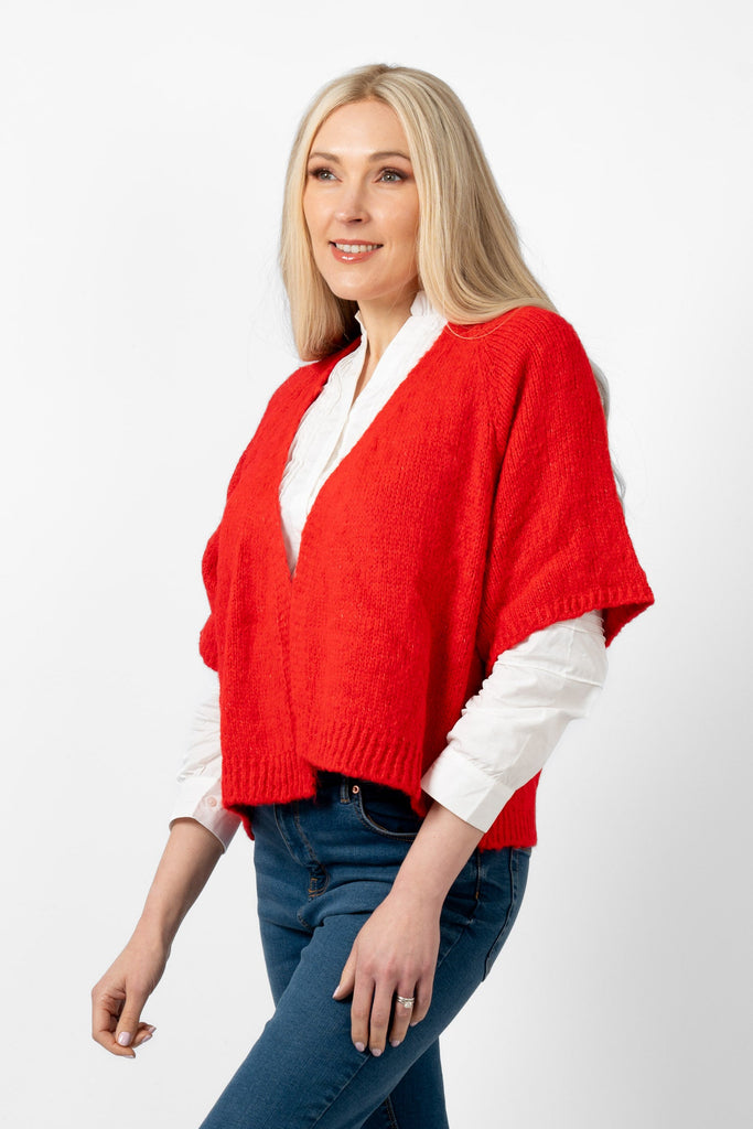 amelia-wool-blend-short-sleeve-cardigan-red-model-showing-side-view-showing-the-loose-fitting-short-sleeves-and-v-neck-front