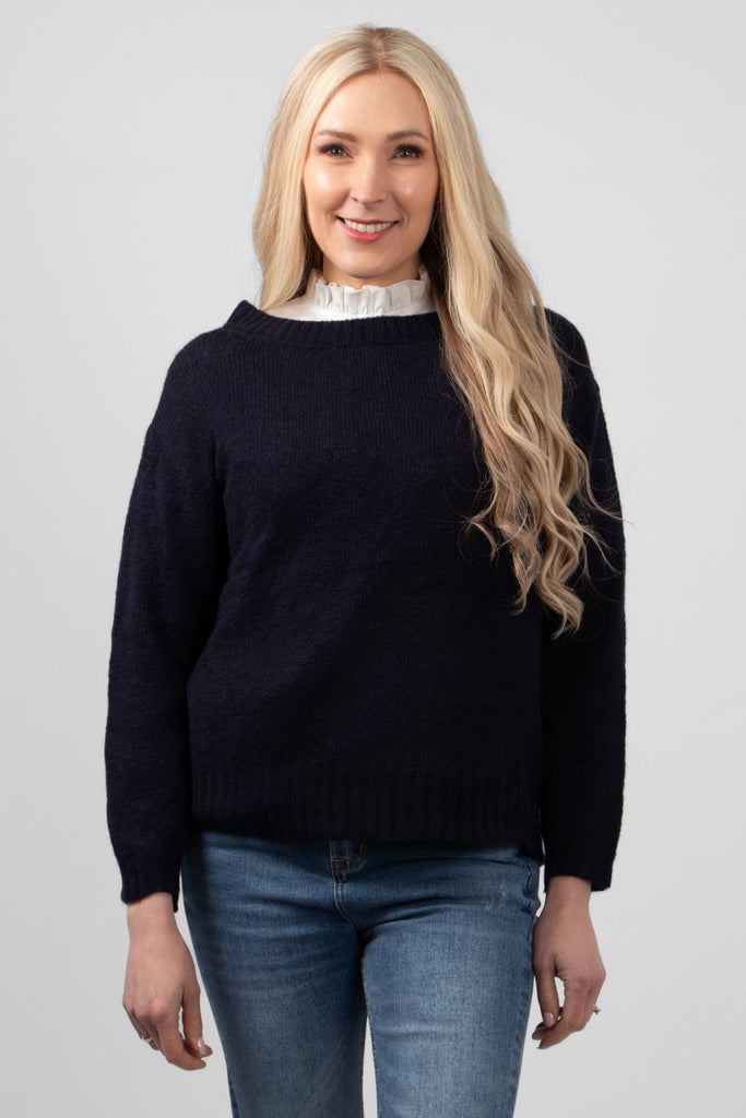paige-wool-blend-round-neck-jumper-navy-blue-styled-with-blue-jeans-and-worn-over-a-white-collared-blouse