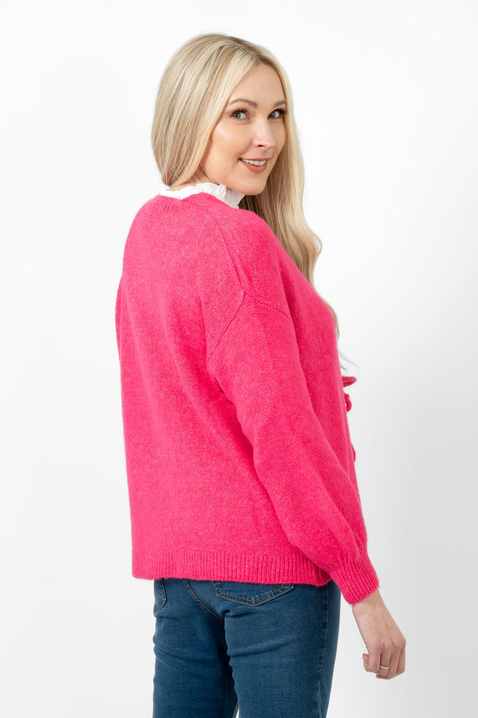 cassidy-tie-front-wool-blend-cardigan-fuchsia-model-showing-a-side-view-the-cardigan-has-full-length-sleeves-and-a-drop-shoulder