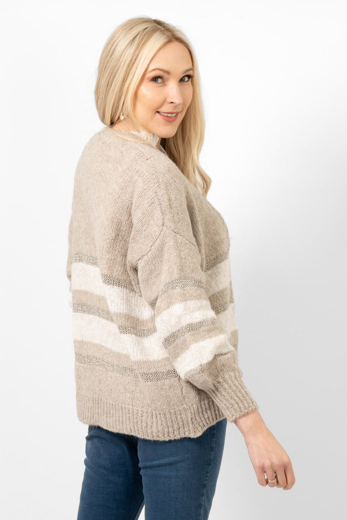 paris-wool-blend-cardigan-beige-cream-gold-striped-model-showing-side-view-the-cardigan-has-long-length-balloon-sleeves