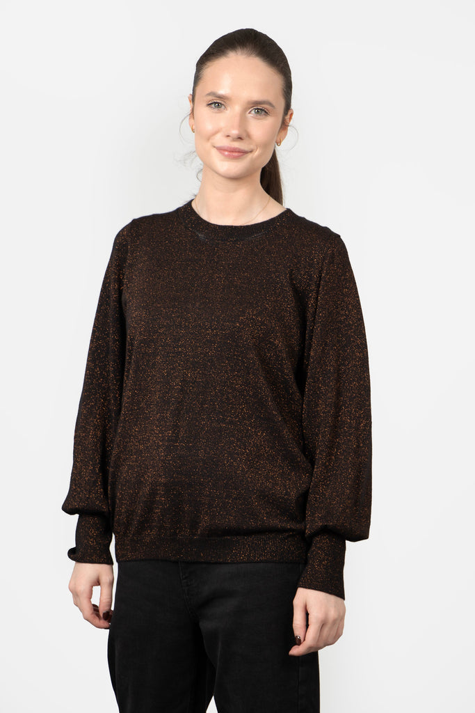 model wearing a bronze sparkly balloon sleeve jumper with a round neck and all over sparkle