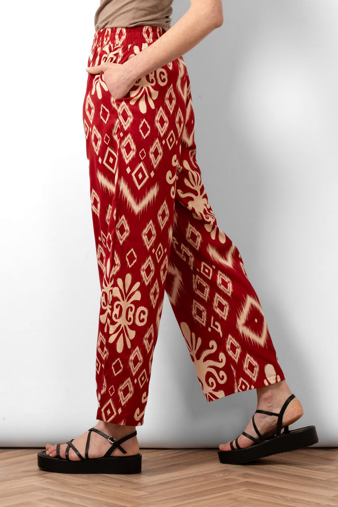 fifi-wide-leg-trousers-red-ikat-side-view-model-showing-pockets