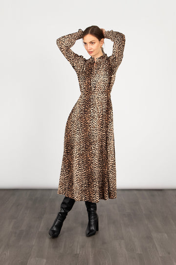 model wearing a long sleeve leopard print midi dress with a grandad frilled collar