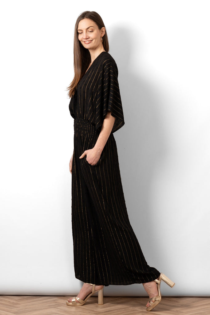 lyra-deep-v-neck-jumpsuit-black-metallic-stripe-side-view-loose-fit