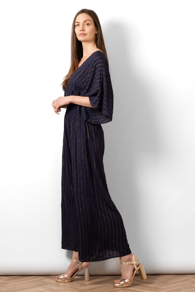 lyra-deep-v-neck-jumpsuit-navy-blue-metallic-stripe-side-view-wide-leg