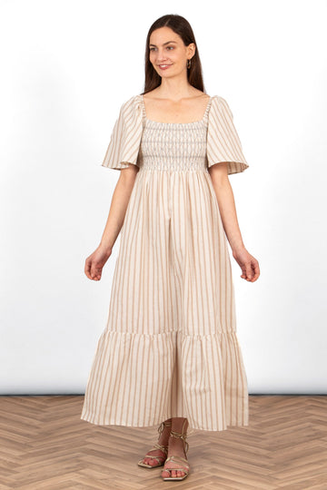 briar-milkmaid-maxi-dress-cream-striped-worn-on-model-front-view-neutral-colours