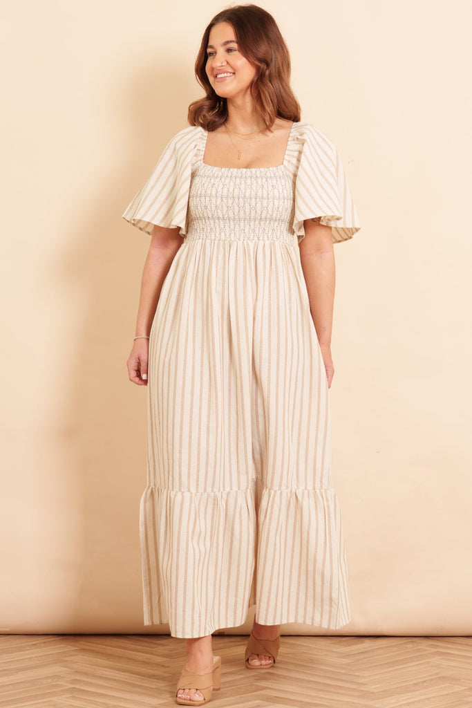 briar-milkmaid-maxi-dress-cream-striped-worn-on-model-front-view-neutral-colours