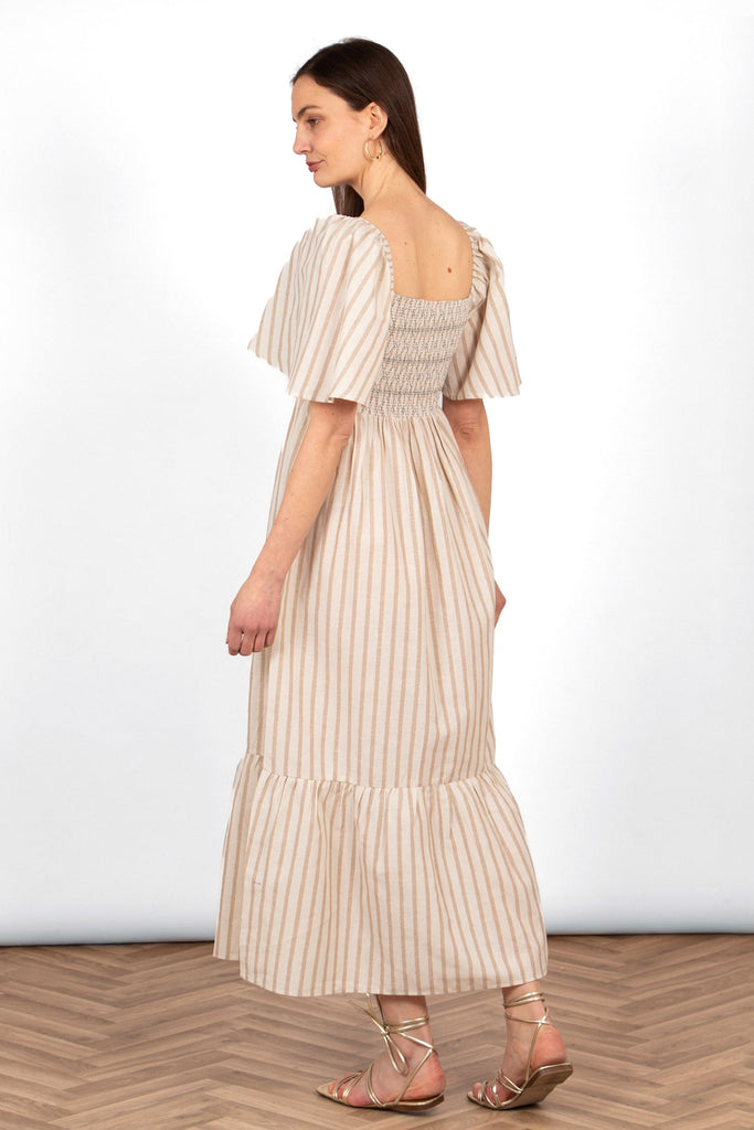 briar-milkmaid-maxi-dress-cream-striped-rear-view-on-model-shirred-bodice-loose-hem