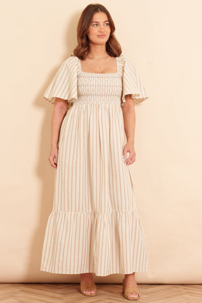 briar-milkmaid-maxi-dress-cream-striped-worn-on-model-front-view-neutral-colours