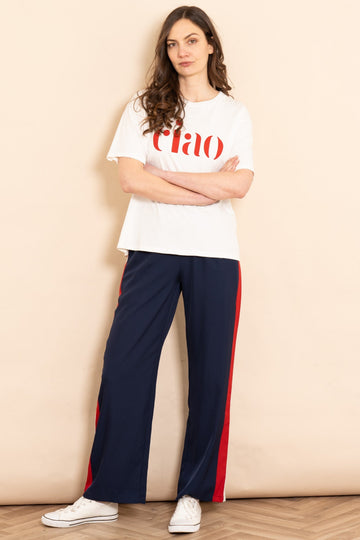 rory-wide-leg-trousers-navy-blue-double-stripe-styled-on-model-white-casual-graphin-tee