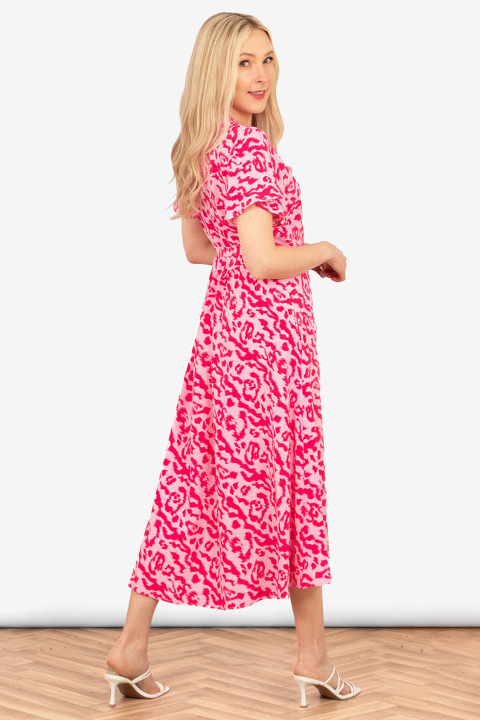 addie-short-sleeve-wrap-dress-pink-animal-print-rear-view-dipped-hem
