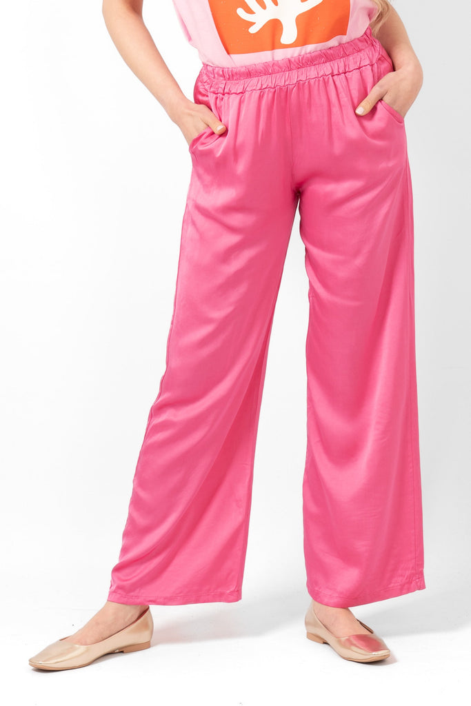 gianna-wide-leg-trousers-hot-pink-on-model-front-view-side-pockets