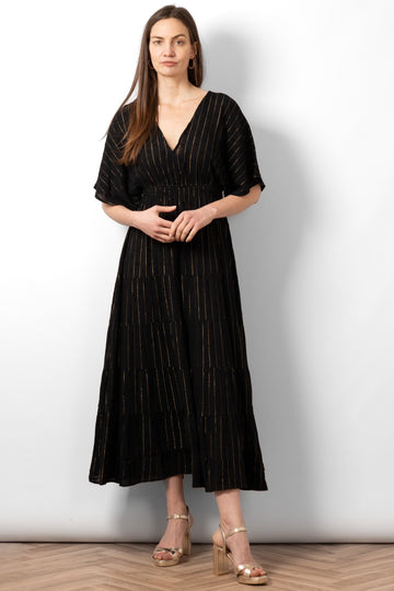 sienna-maxi-kaftan-dress-black-gold-metallic-stripe-styled-on-model-gold-sandals-pinstripe