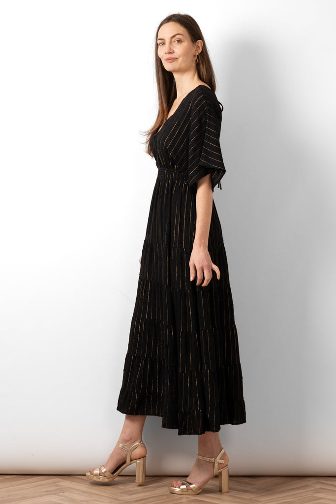 sienna-maxi-kaftan-dress-black-gold-metallic-stripe-side-view-loose-tiered