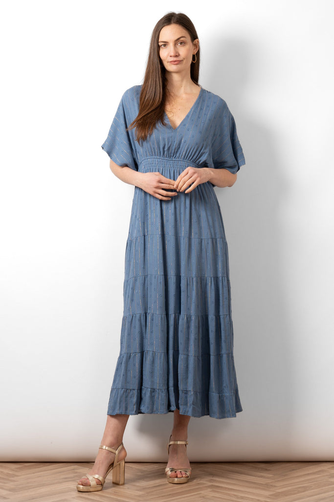 sienna-maxi-kaftan-dress-denim-blue-gold-metallic-stripe-front-view-on-model-v-neck-tiered-loose-fit