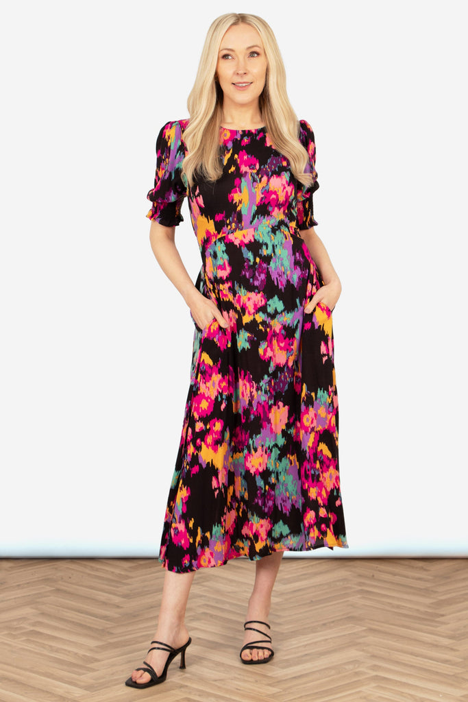 hazel-midi-tea-dress-black-multi-abstract-floral-styled-on-model-heeled-sandals