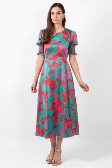 hazel-midi-tea-dress-turquoise-hot-pink-floral-print-front-view-on-model