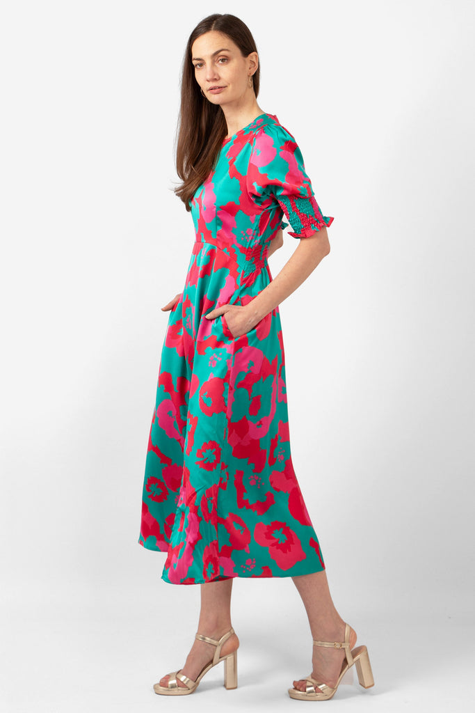 hazel-midi-tea-dress-turquoise-hot-pink-floral-print-side-view-pockets