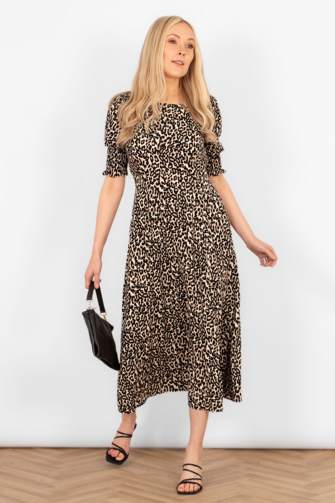 hazel-midi-tea-dress-neutral-leopard-print-styled-with-black-clutch-bag-and-black-sandals