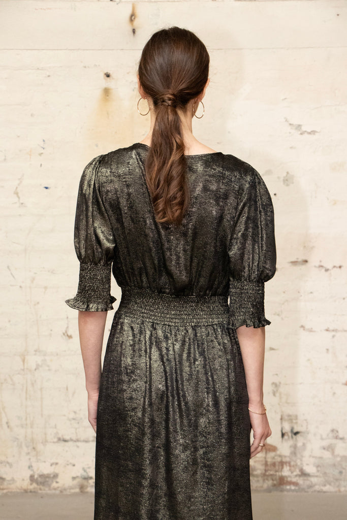 close up of the back of the dress, showing the shirred waist at the back 