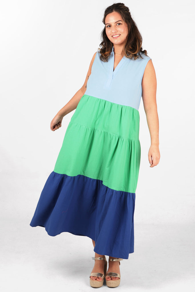 model showing the loose fitting design of this blue and green colourblock maxi dress