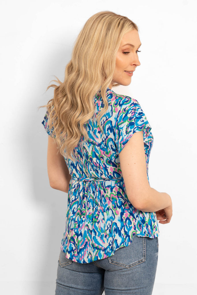 short-sleeve-wrap-top-blue-abstract-print-dipped-hem-rear