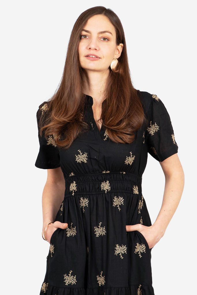 ines-tiered-cotton-maxi-dress-black-gold-embroidered-floral-shirred-waist