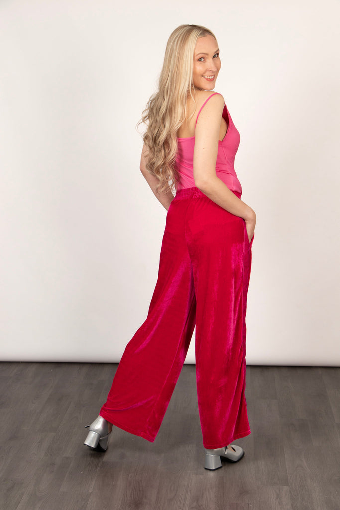 model showing the side of the trousers, showing clearly the wide leg cut of the design