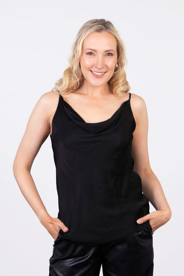 model wearing a black faux silk cowl neck vest top with spaghetti straps