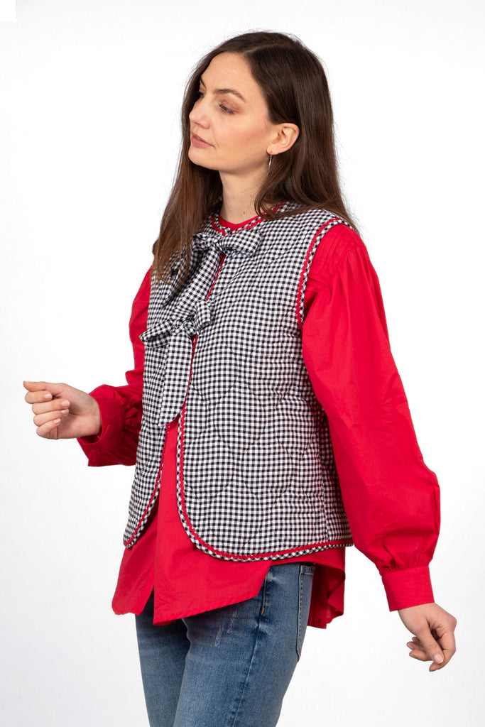 noa-quilted-gilet-black-gingham-layered-over-blouse-front-ties