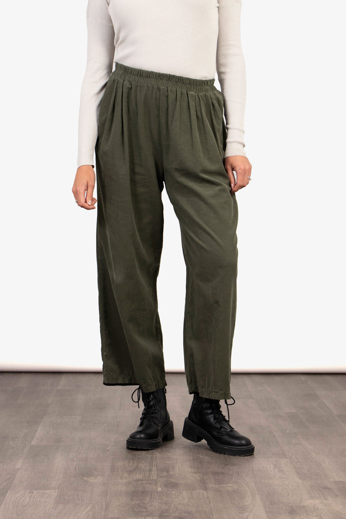 model wearing khaki green cropped wide leg trousers