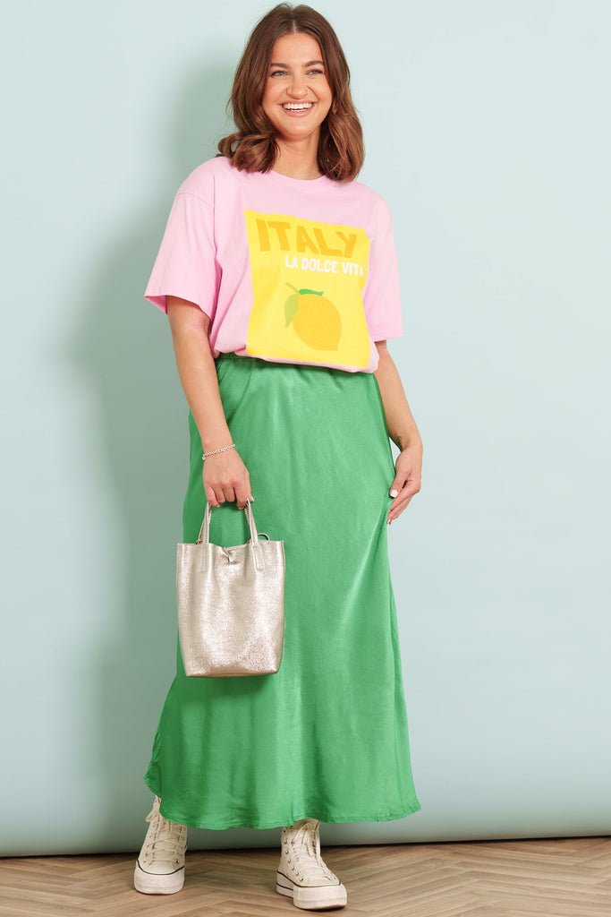 Green-Cassie-Midi-Slip-Skirt-Styled-With-Pink-itality-Graphic-Tee-And-Gold-Small-Tote-Bag