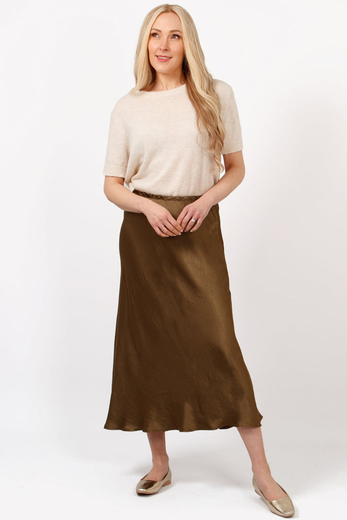 cassie-midi-slip-skirt-khaki-bias-cut-elasticated-waist-worn-on-model