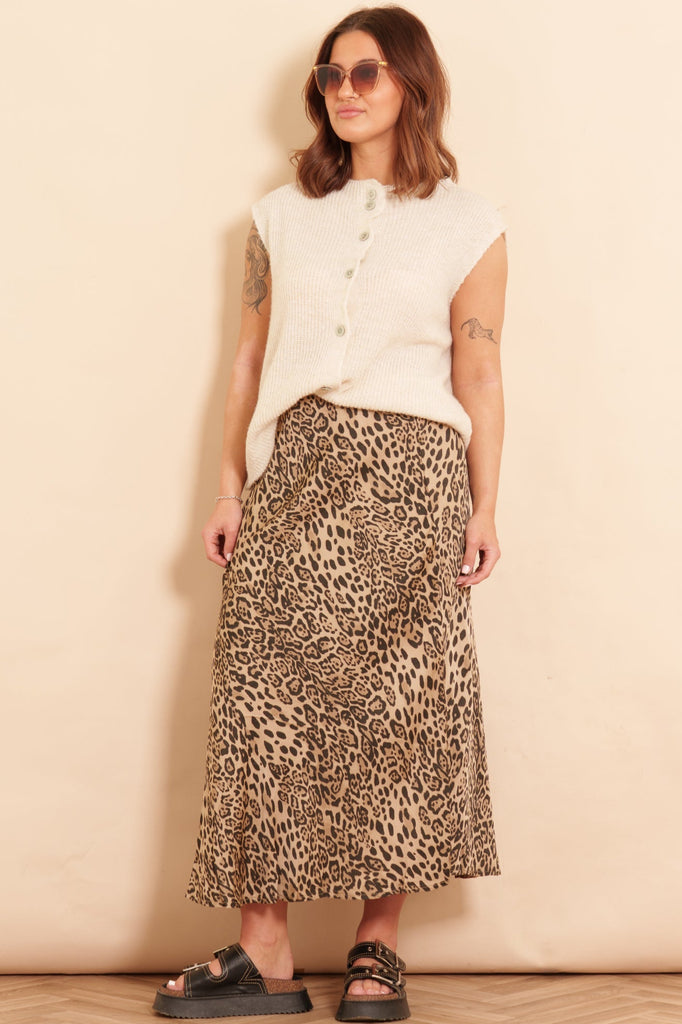 cassie-midi-slip-skirt-neutral-leopard-print-bias-cut-styled-with-cream-knitted-boston-wool-blend-vest-and-black-sandals